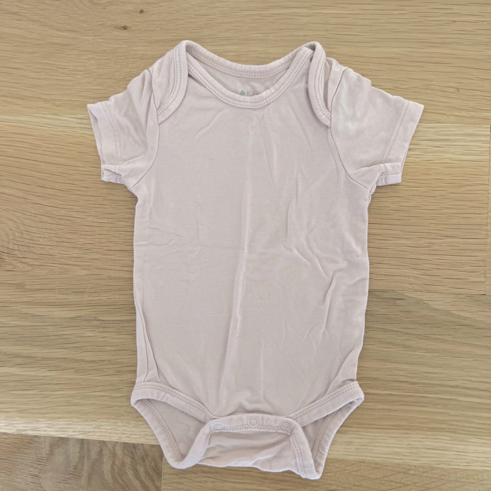 Newborn size like brand new kyte baby bodysuit great condition worn ONCE -pink